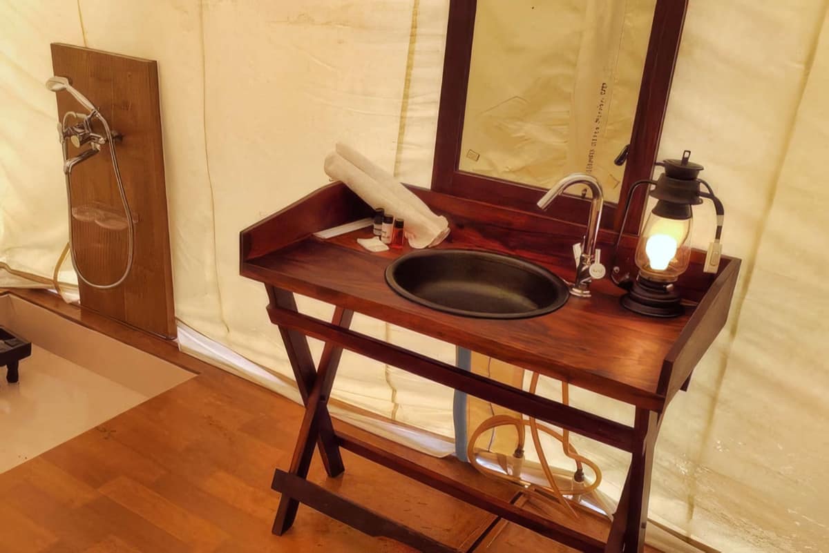 Washbasin inside a Deluxe tent at a Pulp Hotels Kumbh camp