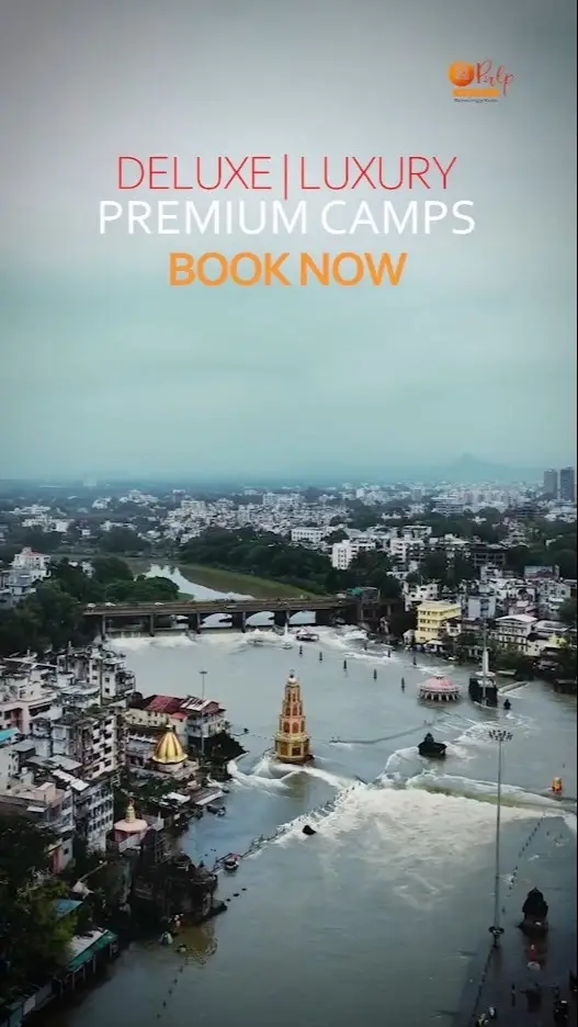 Aerial view of river ghats and temples with the words Deluxe, Luxury, Premium Camps — Book Now