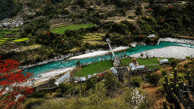 The Yamuna valley near Barkot, with terraced fields and a footbridge over the river